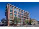 Exterior daytime shot of brick building with many windows at 2000 Arapahoe St # 503, Denver, CO 80205