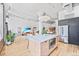 Spacious living area with hardwood floors, open layout, and stainless steel appliances, promoting a modern design at 2000 Arapahoe St # 503, Denver, CO 80205