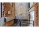 Lobby area with secure mailboxes, brick walls, and tile floors, providing a practical and secure entry for residents at 2000 Arapahoe St # 503, Denver, CO 80205