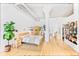 Spacious main bedroom with light wood furniture, concrete ceilings, and hardwood flooring at 2000 Arapahoe St # 503, Denver, CO 80205