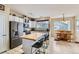 Kitchen with island, stainless steel appliances, and a dining area at 4552 Crestone Peak St, Brighton, CO 80601