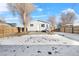 House backyard view with snow and tree at 537 S 2Nd Ave, Brighton, CO 80601