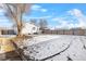 House backyard view with snow and tree at 537 S 2Nd Ave, Brighton, CO 80601