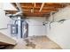 Unfinished basement with water heater and furnace at 537 S 2Nd Ave, Brighton, CO 80601