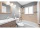 Updated bathroom with new vanity, bathtub, and tile at 537 S 2Nd Ave, Brighton, CO 80601