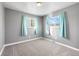 Bright bedroom with neutral walls and carpet at 537 S 2Nd Ave, Brighton, CO 80601