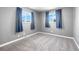 Spacious bedroom with gray walls and new carpet at 537 S 2Nd Ave, Brighton, CO 80601