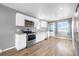 Modern kitchen with white cabinets and stainless steel appliances at 537 S 2Nd Ave, Brighton, CO 80601