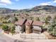 Beautiful home with lush landscaping and a turret, nestled in a picturesque mountain neighborhood at 600 Cascade Dr, Golden, CO 80403