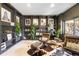Basement space with built-in bookshelves, leather chairs, cow-hide rug and decor at 600 Cascade Dr, Golden, CO 80403