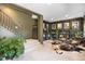 Carpeted basement with dark walls, built-in shelving and three chairs at 600 Cascade Dr, Golden, CO 80403