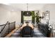 Modern dining room with a long wooden table, black chairs, and a view of the outdoor scenery at 600 Cascade Dr, Golden, CO 80403