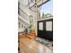 Stunning foyer features hardwood floors, an open staircase, modern light fixture, and large black double doors at 600 Cascade Dr, Golden, CO 80403