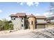 Charming two-story home with stone accents, a turret, and manicured landscaping at 600 Cascade Dr, Golden, CO 80403