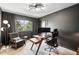 Stylish home office with a modern desk, ergonomic chair, unique lighting, and a view from the window at 600 Cascade Dr, Golden, CO 80403