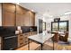 Open kitchen with stainless steel appliances, wooden cabinets and stone countertops at 600 Cascade Dr, Golden, CO 80403