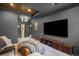 Relaxing media room, furnished with a large flatscreen TV and comfortable sectional seating at 600 Cascade Dr, Golden, CO 80403
