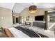 Comfortable main bedroom featuring vaulted ceiling, a ceiling fan, tv, and a walk-in closet at 600 Cascade Dr, Golden, CO 80403