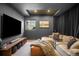 Cozy media room with a large screen TV, comfortable seating, stylish decor, and ambient lighting at 600 Cascade Dr, Golden, CO 80403