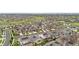Aerial shot featuring a neighborhood with modern homes, green spaces, and mountain views in the distance at 8814 S Winnipeg Ct, Aurora, CO 80016