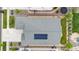 Aerial view of the property showcasing a well-maintained roof with solar panels and a manicured yard at 8814 S Winnipeg Ct, Aurora, CO 80016