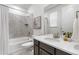 Bathroom with a shower-tub, vanity with sink, and neutral tile design at 8814 S Winnipeg Ct, Aurora, CO 80016