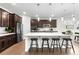 Modern kitchen with stainless steel appliances, sleek countertops, and a convenient breakfast bar at 8814 S Winnipeg Ct, Aurora, CO 80016