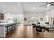 Spacious open floor plan features hardwood floors, kitchen bar seating, and a cozy living area at 8814 S Winnipeg Ct, Aurora, CO 80016