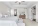 Spacious main bedroom featuring a tray ceiling, neutral color scheme, and access to the en-suite bathroom at 8814 S Winnipeg Ct, Aurora, CO 80016