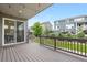 Relax on the covered patio with string lights, overlooking the landscaped backyard and neighboring homes at 8814 S Winnipeg Ct, Aurora, CO 80016