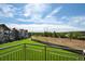 Balcony view of the community and a grassy field at 18726 E Yale Cir # F, Aurora, CO 80013