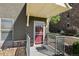 Townhome entrance with red door and security gate at 18726 E Yale Cir # F, Aurora, CO 80013