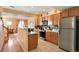 Modern kitchen with stainless steel appliances and light wood cabinets at 18726 E Yale Cir # F, Aurora, CO 80013