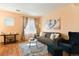 Living room with sofa, armchair, and a coffee table at 18726 E Yale Cir # F, Aurora, CO 80013