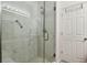 Walk-in shower with marble tile and glass enclosure at 18726 E Yale Cir # F, Aurora, CO 80013