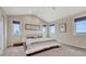 Spacious bedroom with vaulted ceilings, neutral tones, and multiple windows providing natural light at 1820 S State 83 Hwy, Franktown, CO 80116