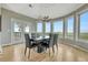 Bright dining room features a modern chandelier and scenic views through large windows at 1820 S State 83 Hwy, Franktown, CO 80116