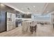 Stylish kitchen features stainless steel appliances, sleek cabinetry, and a center island with seating at 1820 S State 83 Hwy, Franktown, CO 80116