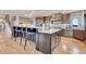 Modern kitchen with dark wood cabinets, granite countertops, and stainless steel appliances at 1820 S State 83 Hwy, Franktown, CO 80116