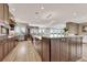 Open-concept kitchen with stainless appliances, granite countertops, and a large island for entertaining at 1820 S State 83 Hwy, Franktown, CO 80116
