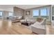 Open living area has a modern fireplace, comfortable seating, and plenty of windows offering a view at 1820 S State 83 Hwy, Franktown, CO 80116