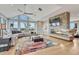 Bright living room with vaulted ceilings, fireplace, scenic windows, and comfortable seating for entertaining at 1820 S State 83 Hwy, Franktown, CO 80116