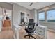 Bright home office with modern desk and views of the surrounding landscape at 1820 S State 83 Hwy, Franktown, CO 80116