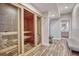 Relaxing sauna room with glass enclosure and tiled floors in a serene setting at 1820 S State 83 Hwy, Franktown, CO 80116