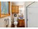 Cozy bathroom featuring a blue sink, framed mirror, and a glass-enclosed shower at 9113 E Evans Way, Denver, CO 80231
