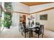 Dining room featuring a vaulted ceiling and large windows at 9113 E Evans Way, Denver, CO 80231