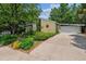 Well maintained single-story home with a spacious driveway and landscaped front yard at 9113 E Evans Way, Denver, CO 80231
