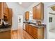 Well-lit kitchen featuring granite countertops, wood cabinets and stainless steel appliances at 9113 E Evans Way, Denver, CO 80231