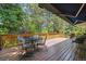 Rear deck with a retractable awning and patio seating at 9113 E Evans Way, Denver, CO 80231