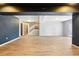 Large finished basement space with stairs and a sliding glass door for outside access at 13071 Emerson St, Thornton, CO 80241